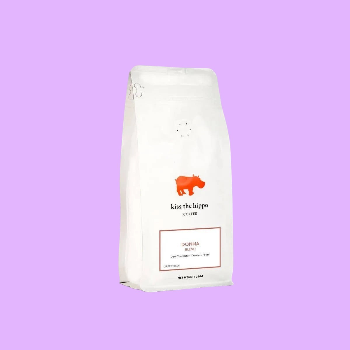 Kiss the Hippo organic whole bean coffee in a white nitrogen-flushed bag featuring a red hippo logo and Donna blend label (view 2).