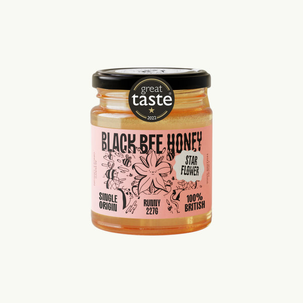 BRiMM Black Bee Honey Raw Starflower Honey in a glass jar with a pink label and Great Taste Award sticker.