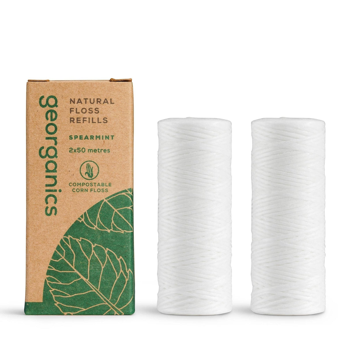 georganics spearmint dental floss refills in a sustainable cardboard box with two white bio-nylon floss spools