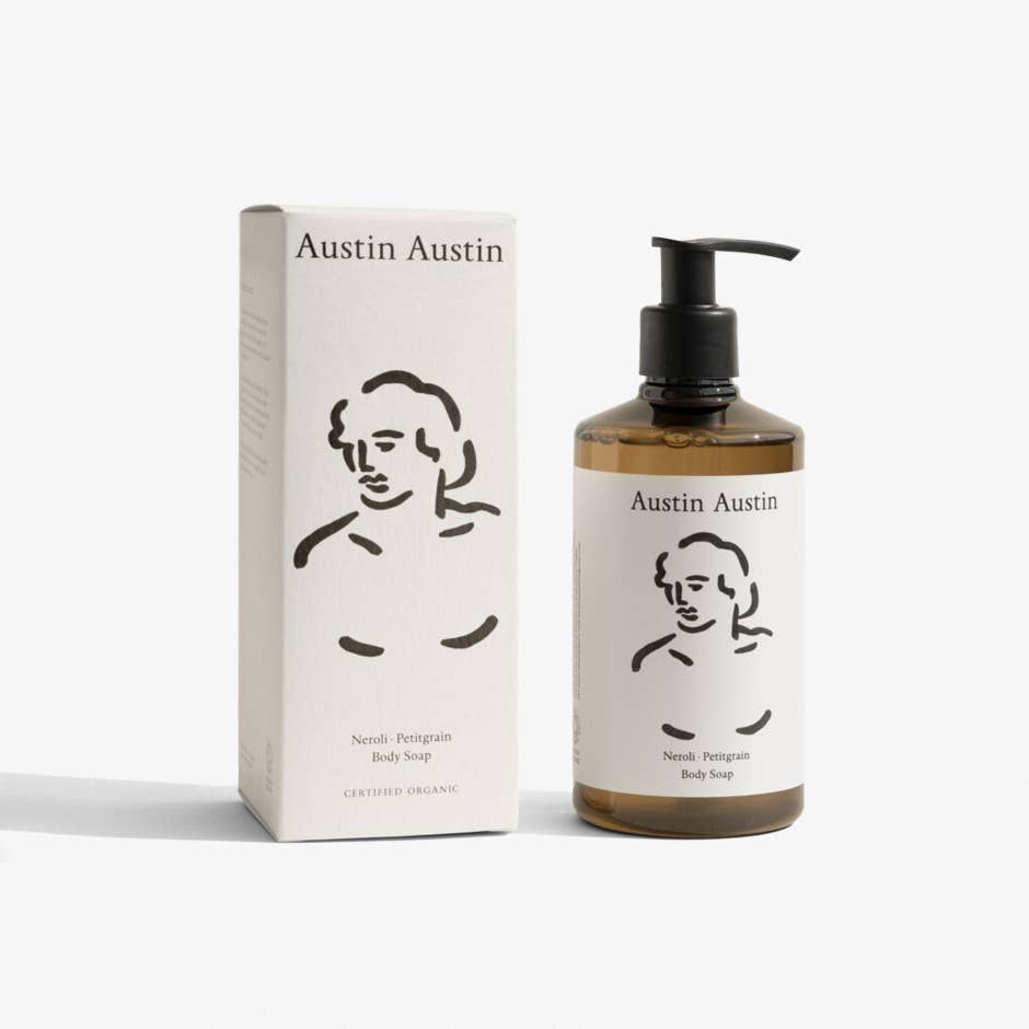 Austin Austin Neroli and Petitgrain Body Soap 300ml amber bottle with black flip-top cap and white label featuring Christian Newby Indian ink figurative drawing, photographed front-on against a plain white background
