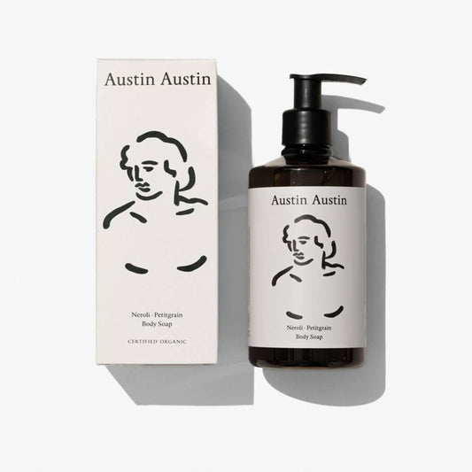 Austin Austin Neroli and Petitgrain Body Soap 300ml amber bottle with black flip-top cap and white label featuring Christian Newby Indian ink figurative drawing, photographed top down against a plain white background