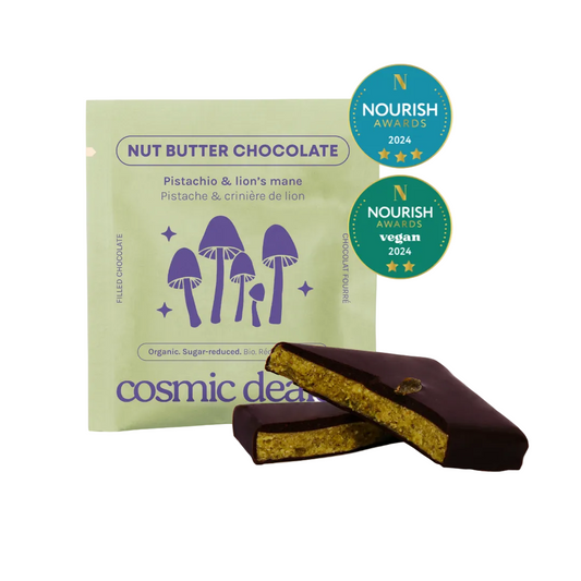 Cosmic Dealer nut butter chocolate with packaging and two pieces on a beige background