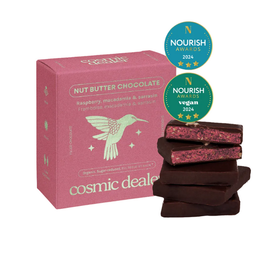 Cosmic Dealer Nut Butter Chocolate bars with packaging and Nourish Awards badges on a beige background