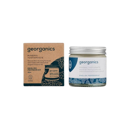 Georganics mineral toothpaste in a glass jar with a cardboard box, featuring English peppermint and natural ingredients.