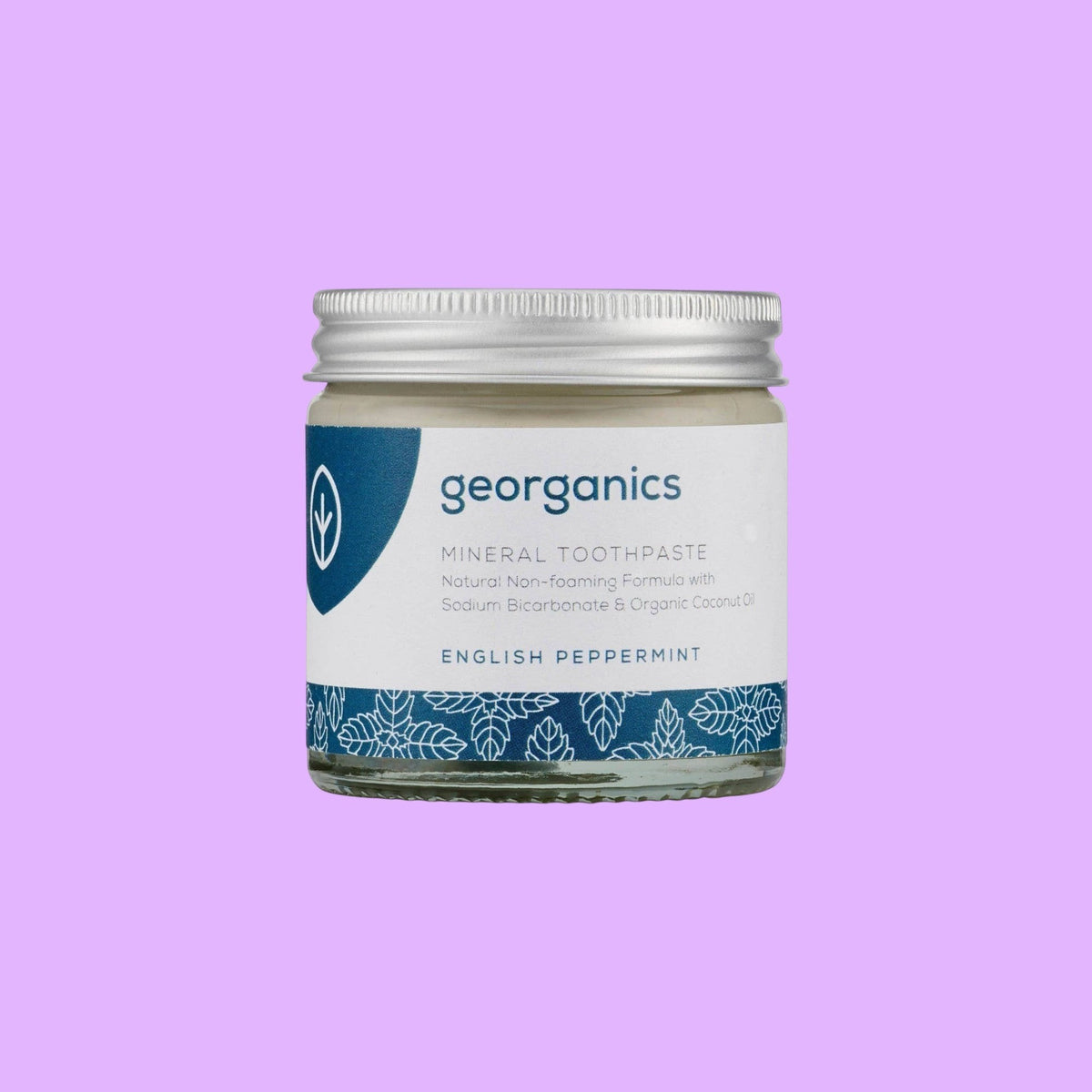 Georganics natural peppermint mineral toothpaste in a glass jar with an aluminium lid and blue label (view 2).
