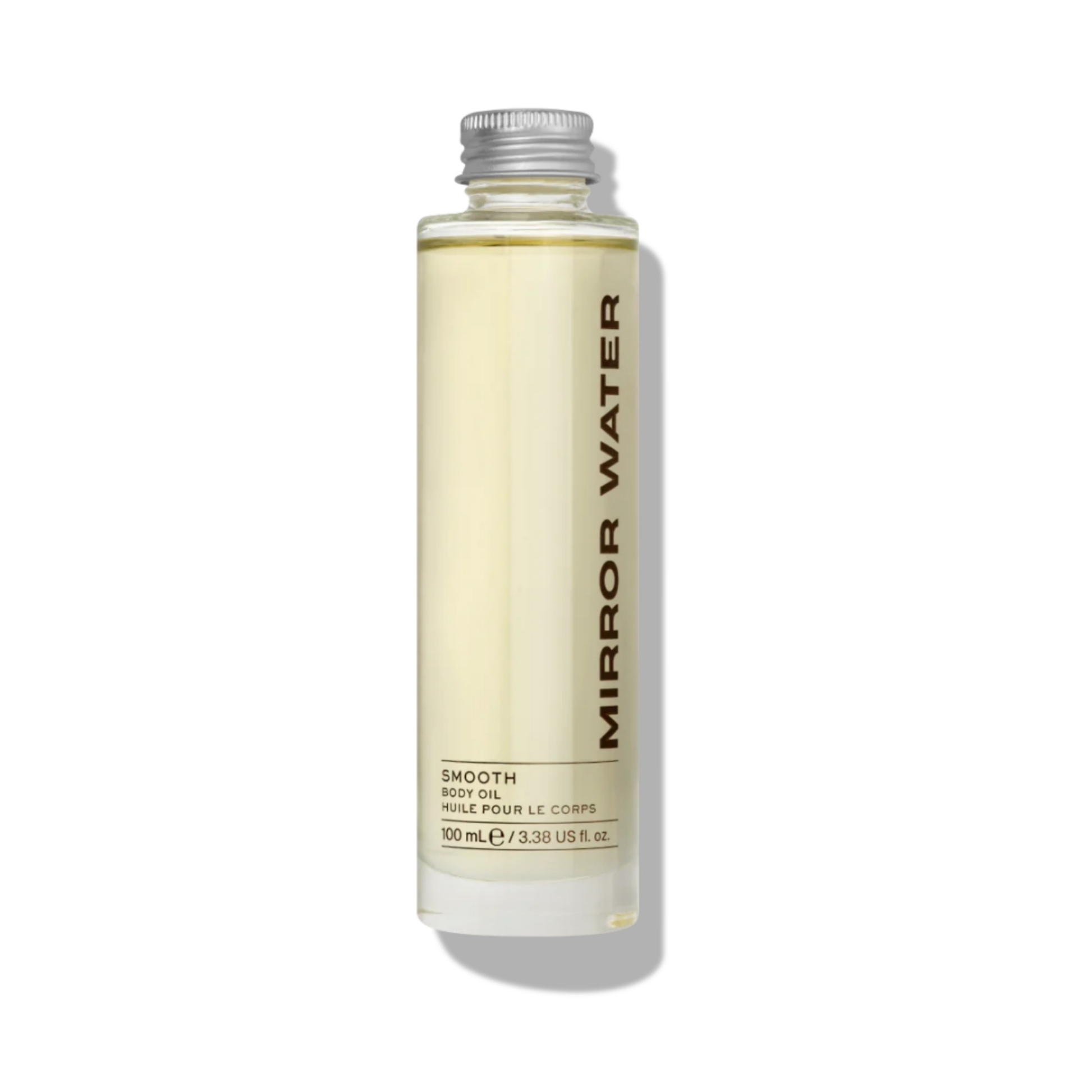 Glass bottle of Mirror Water SMOOTH Body Oil, 100ml, with silver cap on a neutral beige background. The label reads Mirror Water in vertical black text.