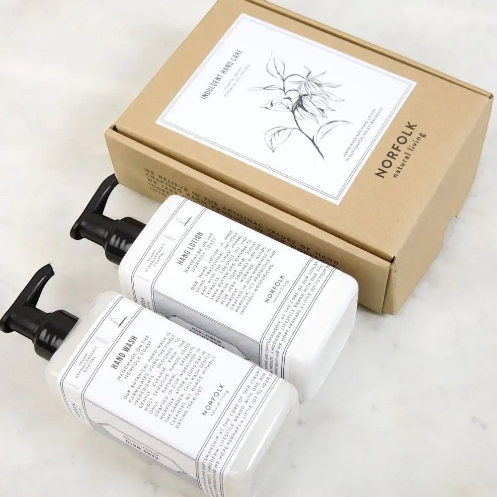 Norfolk Natural Living Indulgent Hand Care Set featuring Coastal Walks hand wash and lotion in white pump bottles with a gift box.