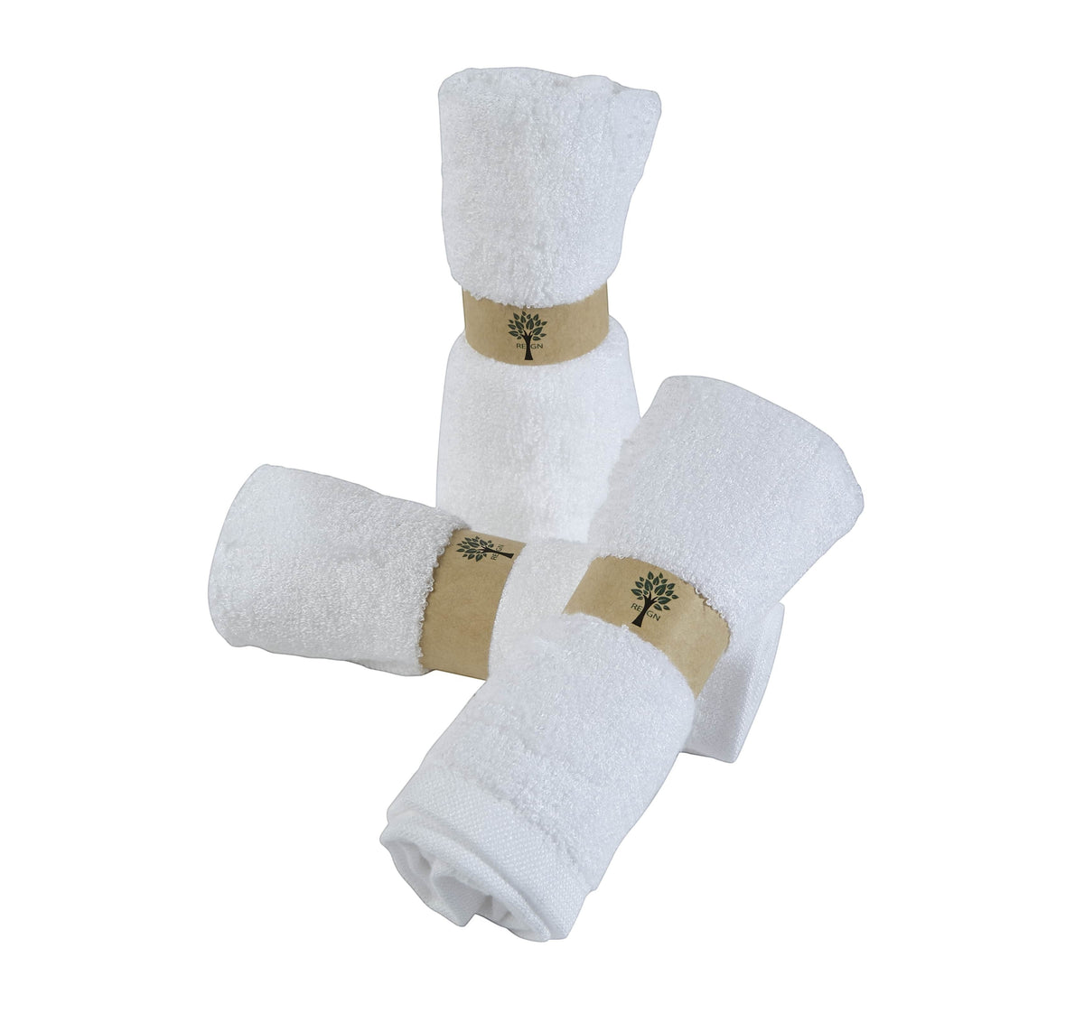 Re:gn organic bamboo face cloths in white, rolled and secured with eco-friendly paper bands.