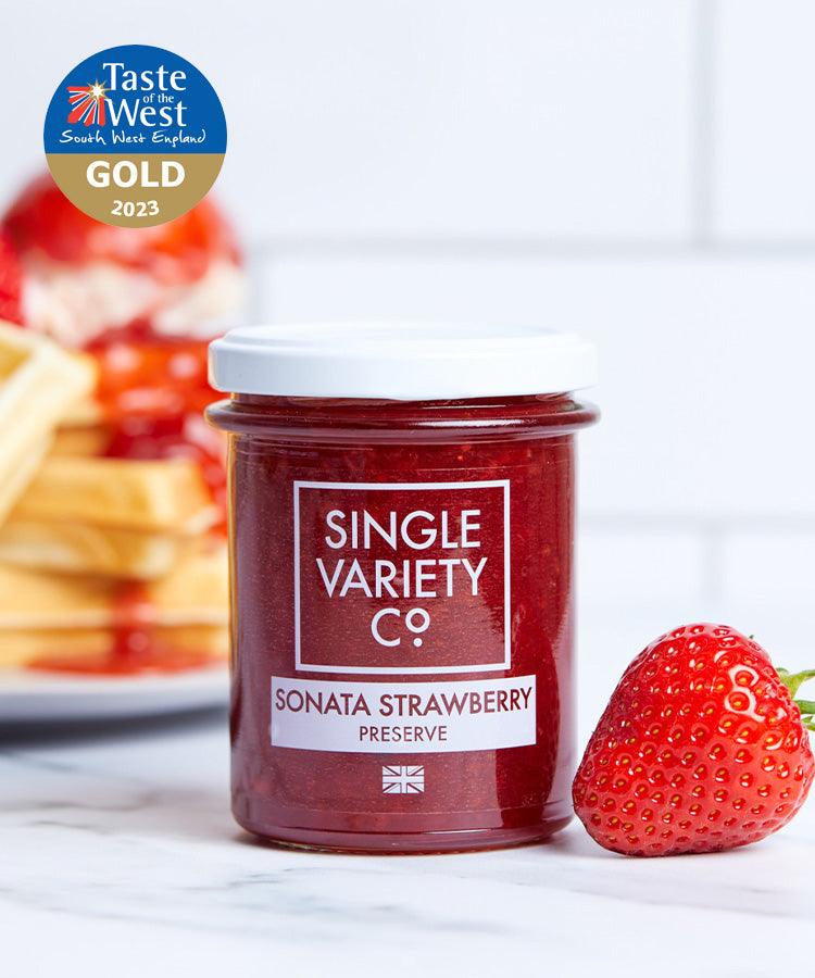 Single Variety Co Sonata Strawberry Preserve, in a lifestyle setting.
