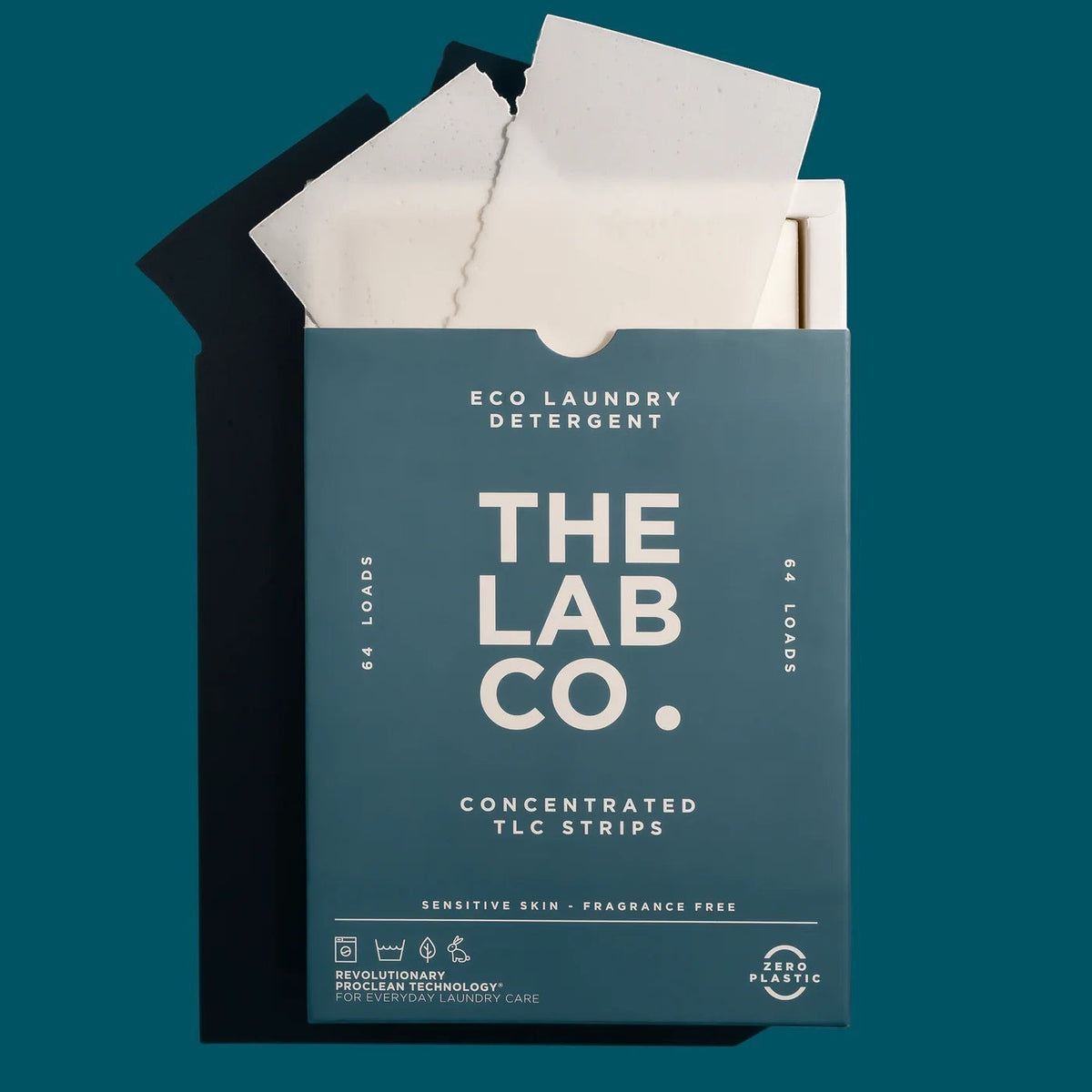 The Lab Co. fragrance-free laundry detergent strips in a plastic-free teal box for 64 loads of laundry.