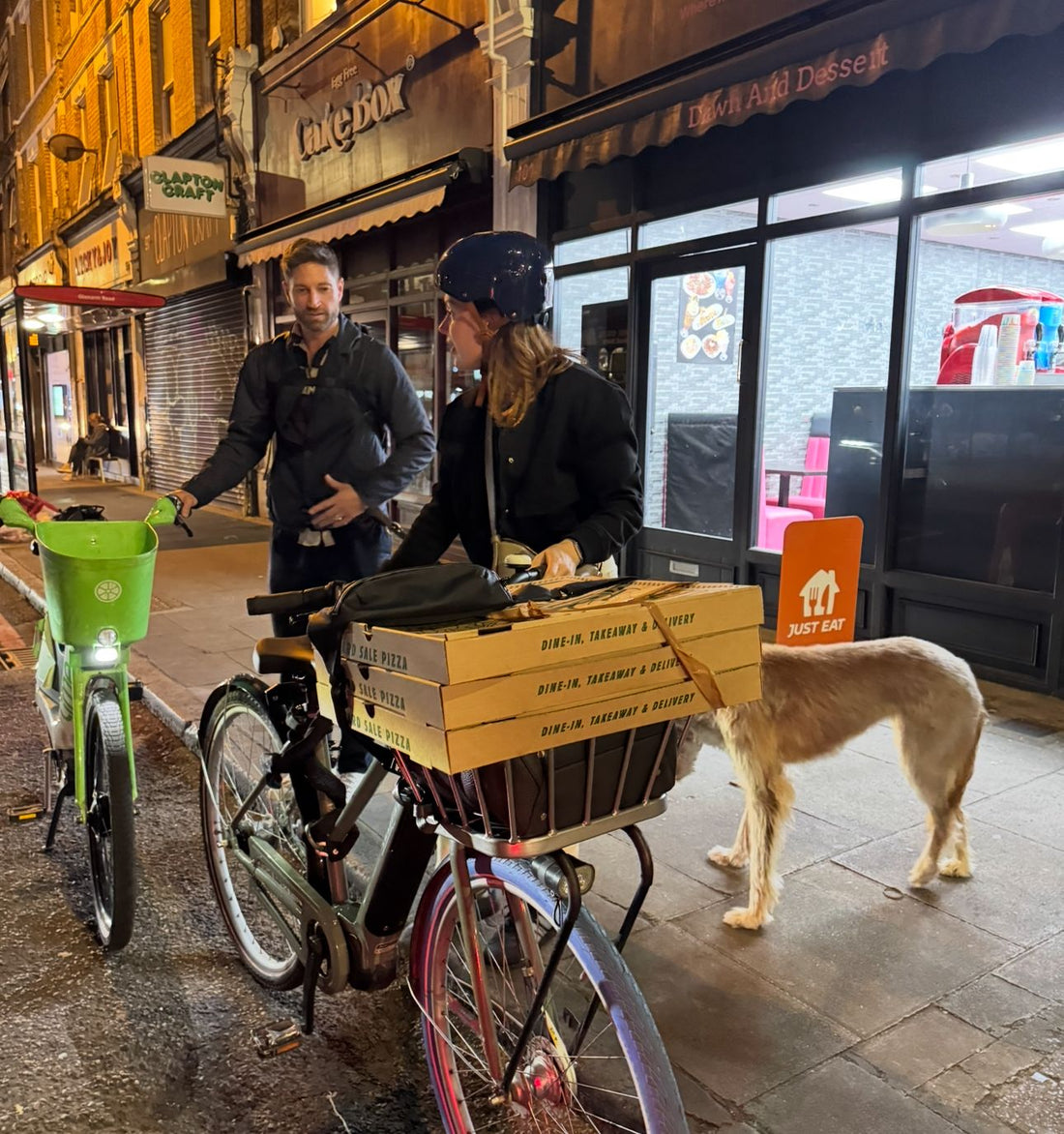 Image created by Conrad's wife and a friend showing how it's possible to carry three 20inch Yard Sale Pizzas on a Swapfiets bike