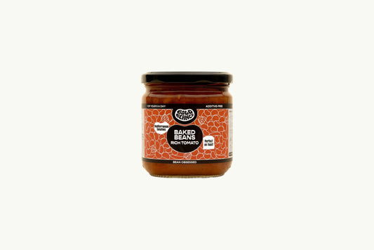 Bold Bean Co Rich Tomato Baked Beans in a 325g glass jar with a vibrant orange label featuring Mediterranean tomato sauce.