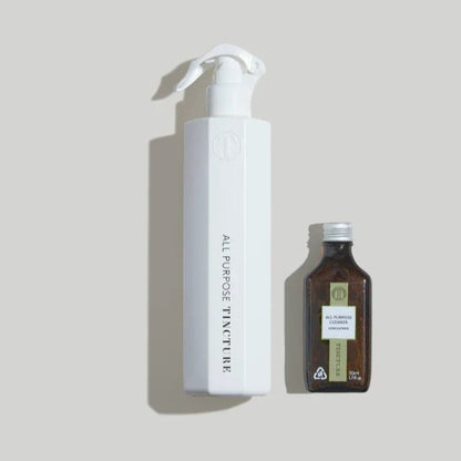 Tincture London all purpose cleaner starter kit with a white reusable spray bottle and concentrated refill, in a lifestyle setting.