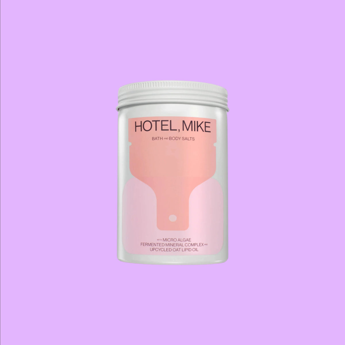 Hotel Mike Bath + Body Salts in a recyclable jar featuring upcycled oat lipid oil and fermented mineral complex ingredients.