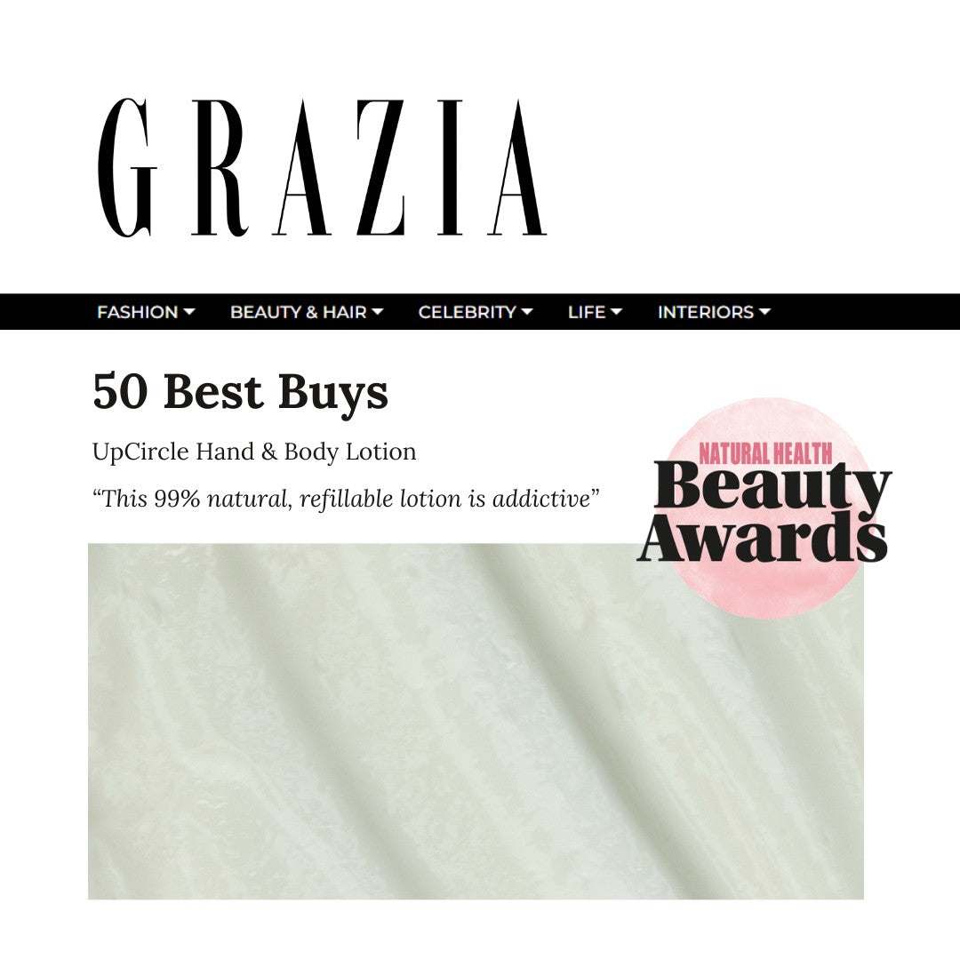 UpCircle hand and body lotion in a frosted green glass bottle with bergamot and vitamin E, featured in Grazia magazine.