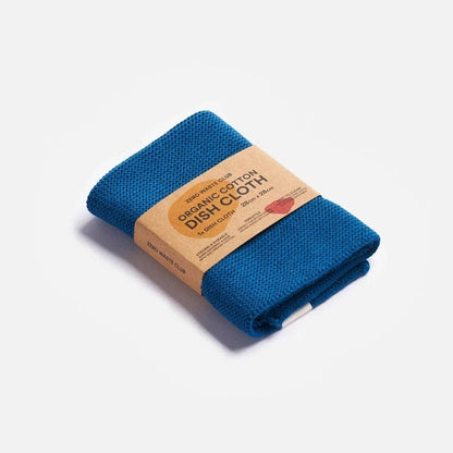 Zero Waste Club blue organic cotton dish cloth with a textured weave, folded and secured with a cardboard belly band.