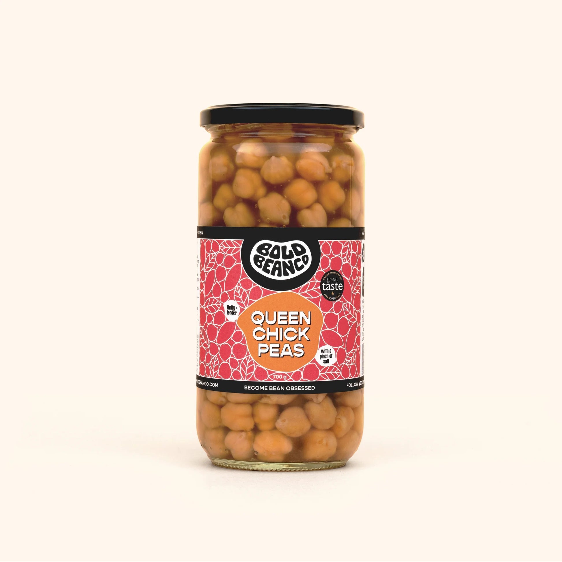 Bold Bean Co Queen Chickpeas in a 700g glass jar featuring heirloom garbanzo beans with a creamy texture, in a lifestyle setting.