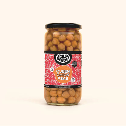 Bold Bean Co Queen Chickpeas in a 700g glass jar featuring heirloom garbanzo beans with a creamy texture, in a lifestyle setting.