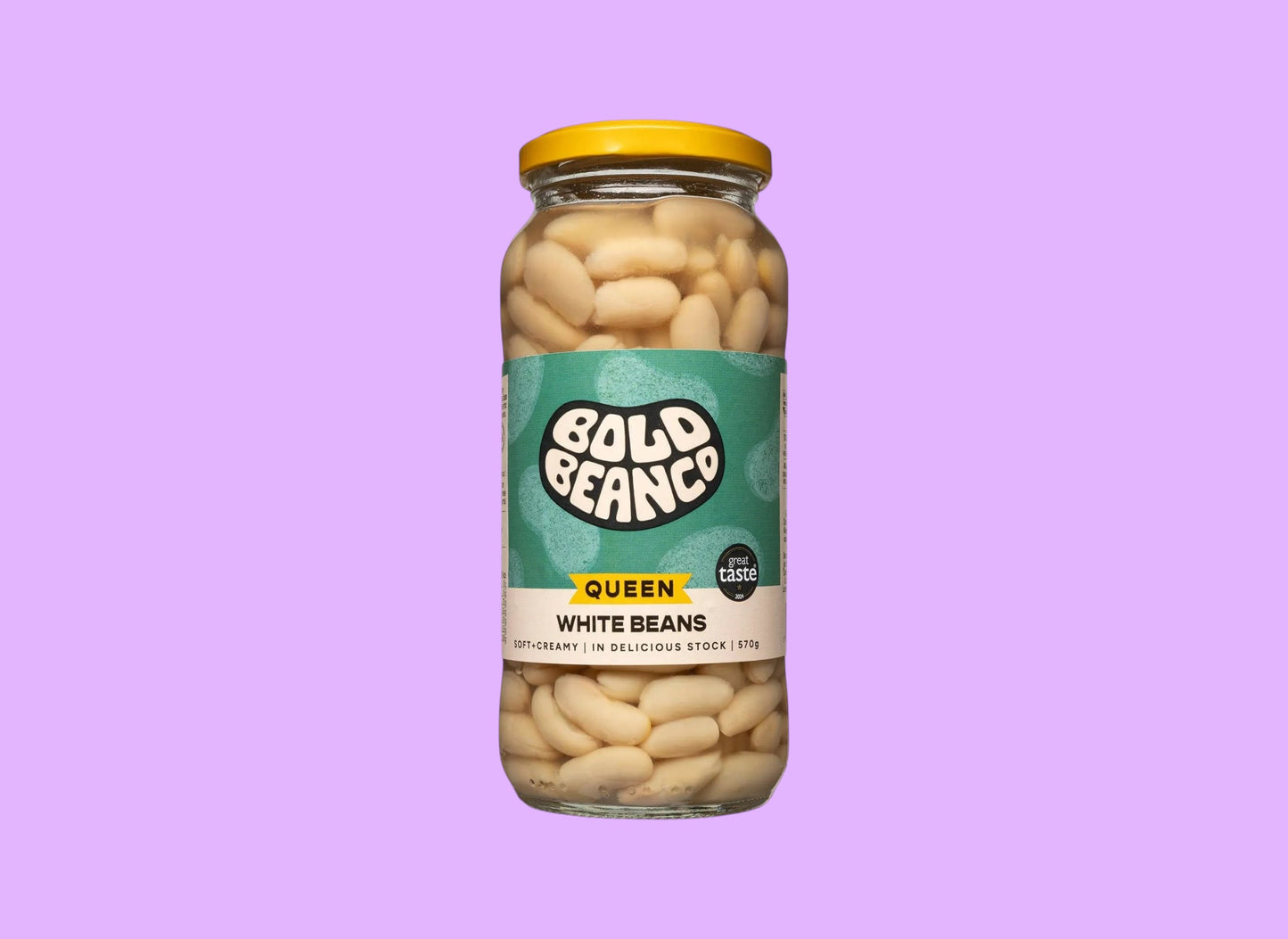 Bold Bean Co Queen white beans in a 570g glass jar with a yellow lid and green label, shown from a different angle.