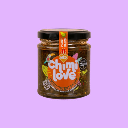 Chimi Love medium chimichurri sauce in a glass jar with vibrant herb-forward ingredients and plant-based label, shown from a different angle.