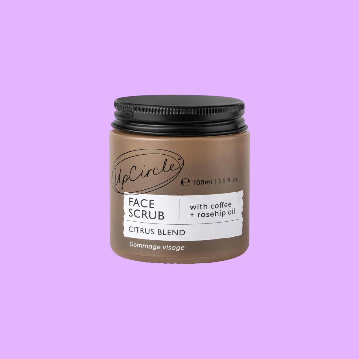 UpCircle face scrub in a brown glass jar with a black aluminium lid, featuring coffee and rosehip oil ingredients, shown from a different angle.