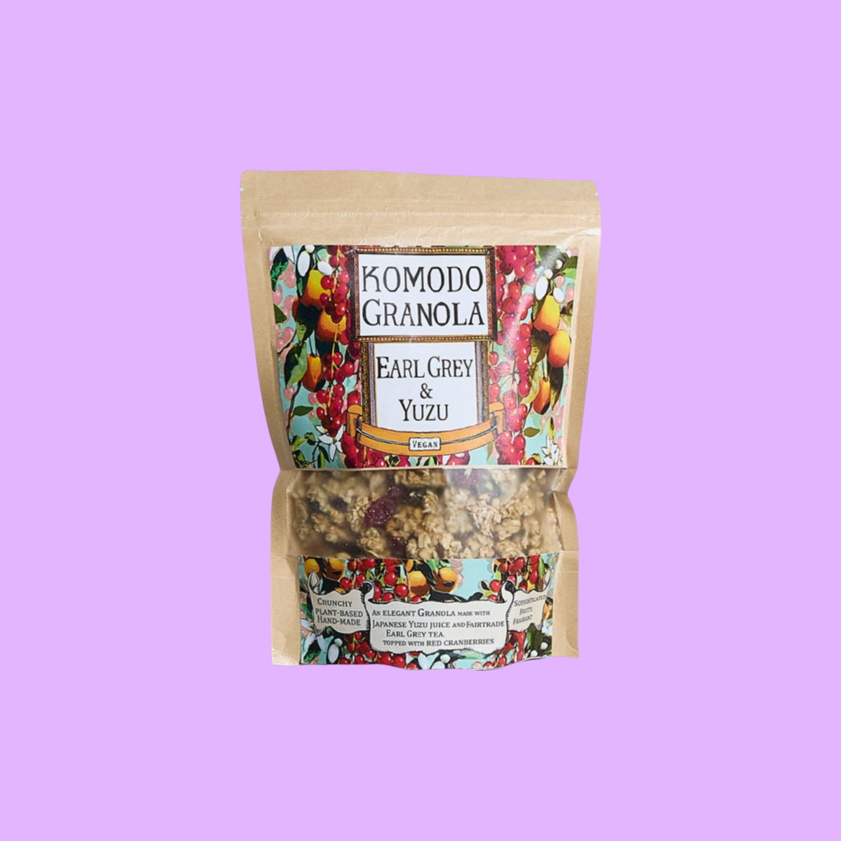 Komodo Bakery Earl Grey and Yuzu granola in a stand-up pouch with vibrant botanical label and dried fruit