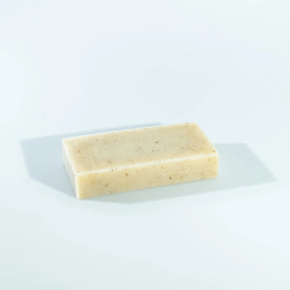 dulcie exfoliating seaweed block soap with a natural beige texture and visible botanical inclusions