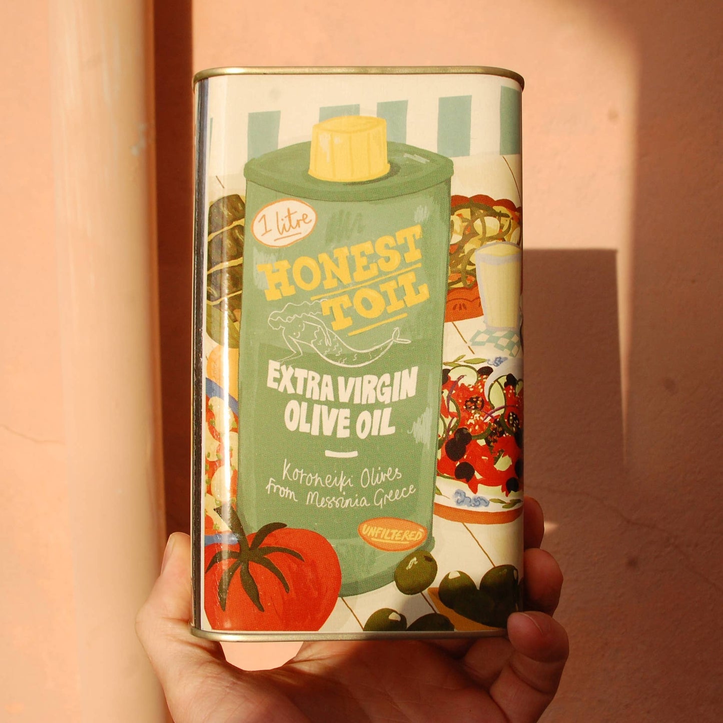 Honest Toil UK 1L can of unfiltered extra virgin olive oil with illustrated Greek dish artwork by Zena Kay