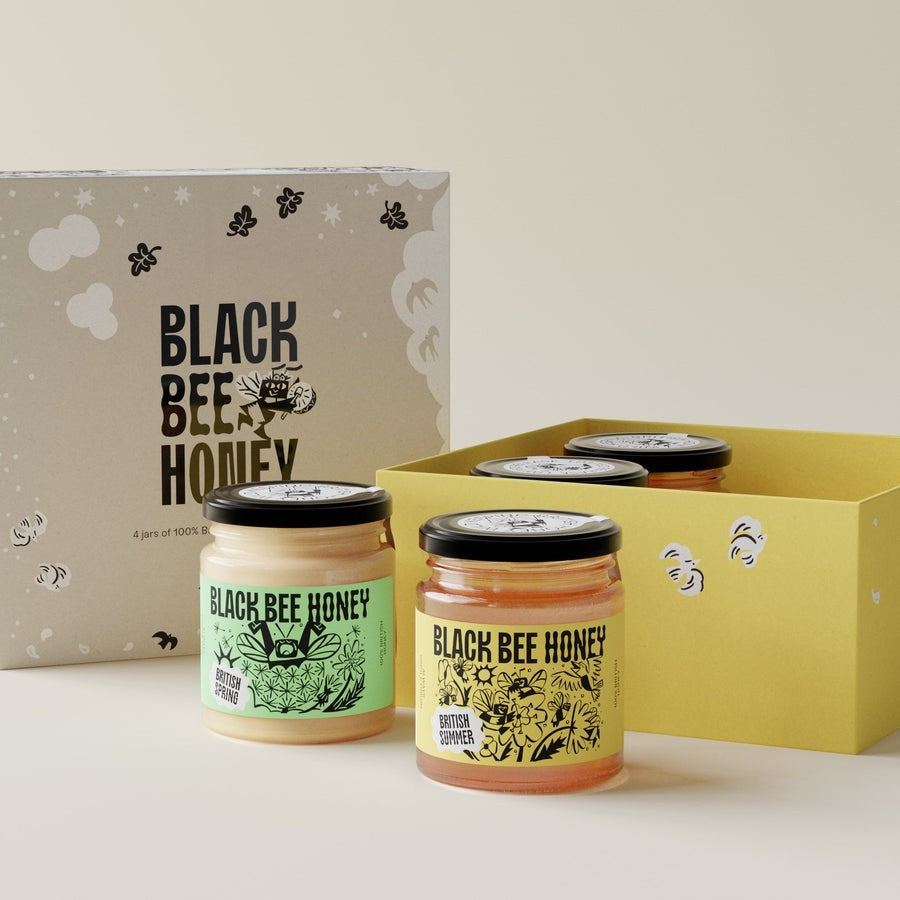 Black Bee Honey Four Seasons Mini Honey Gift Box featuring four jars of British honey in an illustrated presentation box.