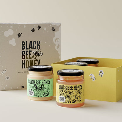 Black Bee Honey Four Seasons Mini Honey Gift Box featuring four jars of British honey in an illustrated presentation box.