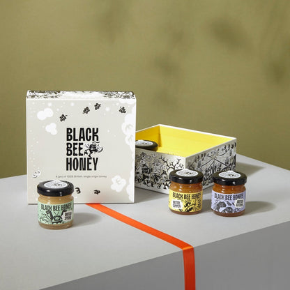 Black Bee Honey Four Seasons mini honey gift box featuring four single-origin British honey jars in an illustrated box.