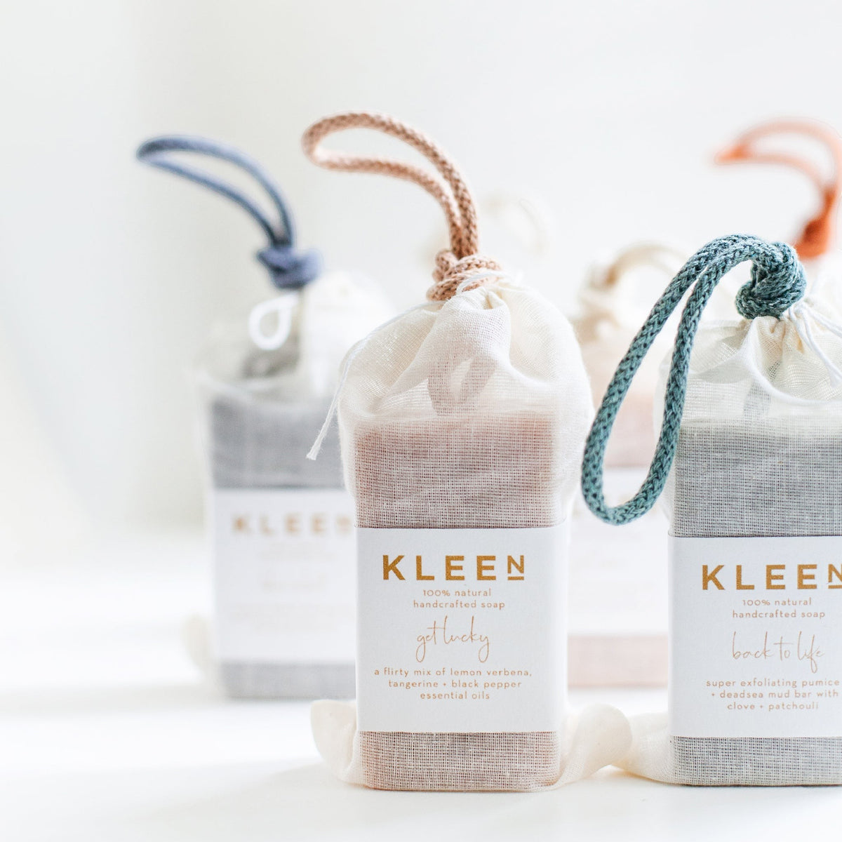 BRiMM Good Vibrations soap on a rope in a sheer pouch with a hanging cord, featuring artisanal cold-process soap.