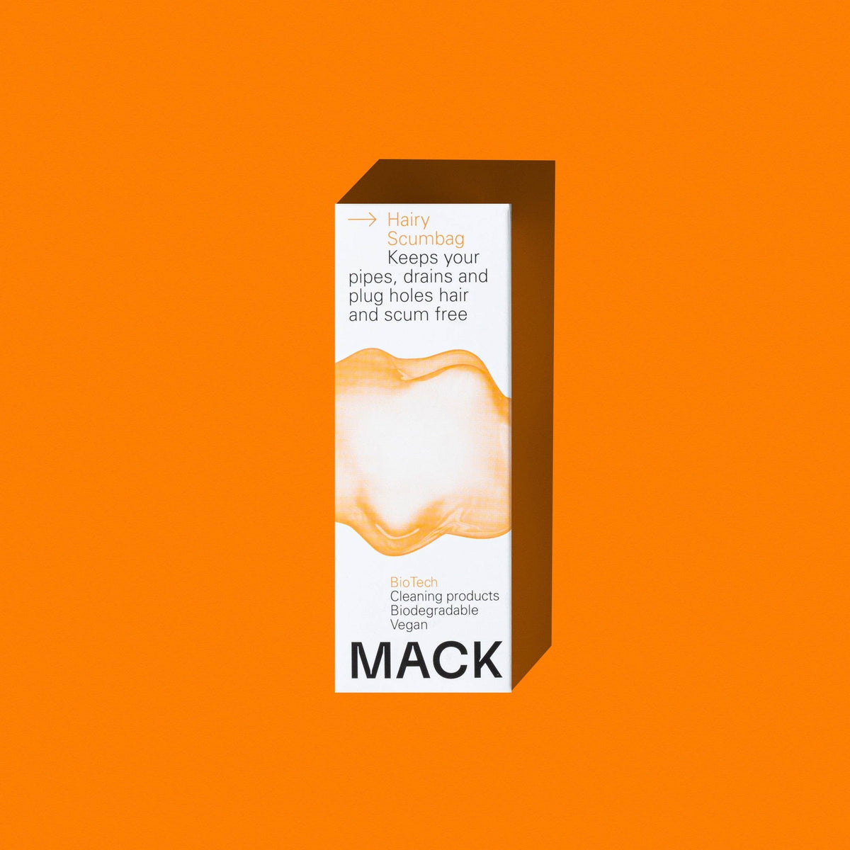 Mack Hairy Scumbag drain maintainer box with enzyme-based cleaning formula on a vibrant orange background.
