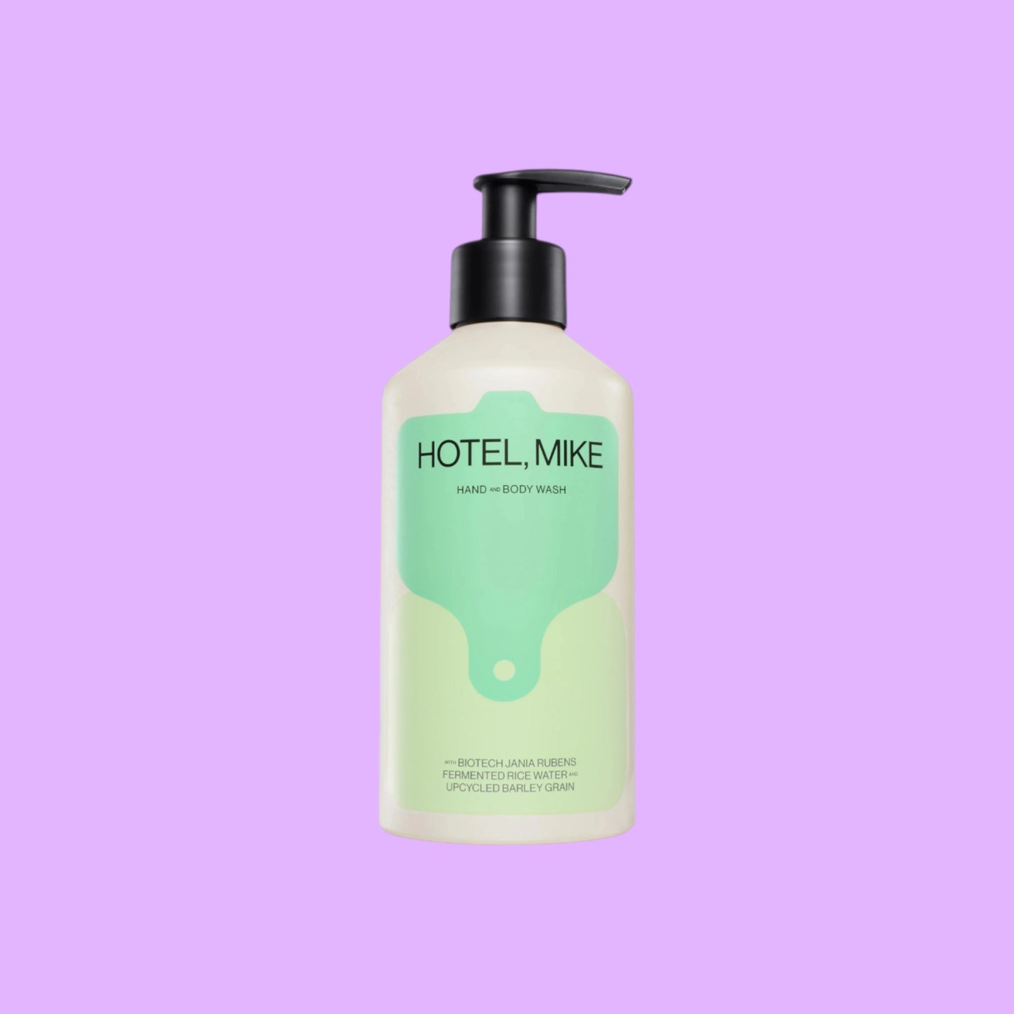 Hotel Mike Hand & Body Wash in a recyclable aluminium bottle with a black pump dispenser and green label design.