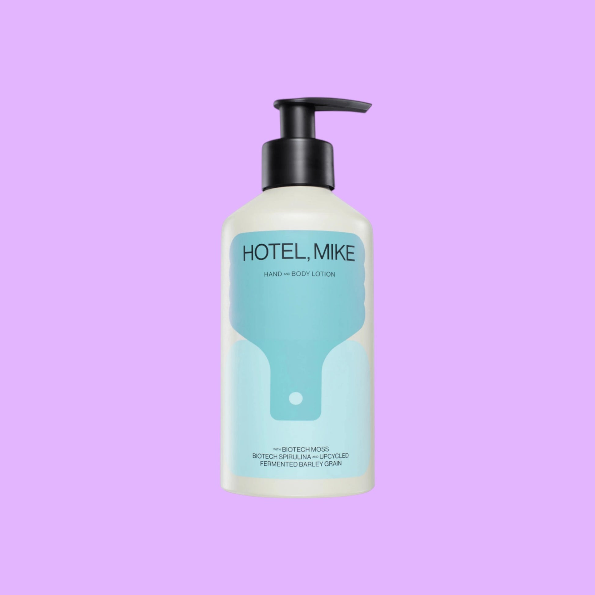Hotel, Mike hand and body lotion in a sustainable aluminium bottle with a black pump dispenser, shown from a different angle.