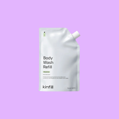 Kinfill 500ml body wash refill pouch in white with minimalist typography on a light purple background