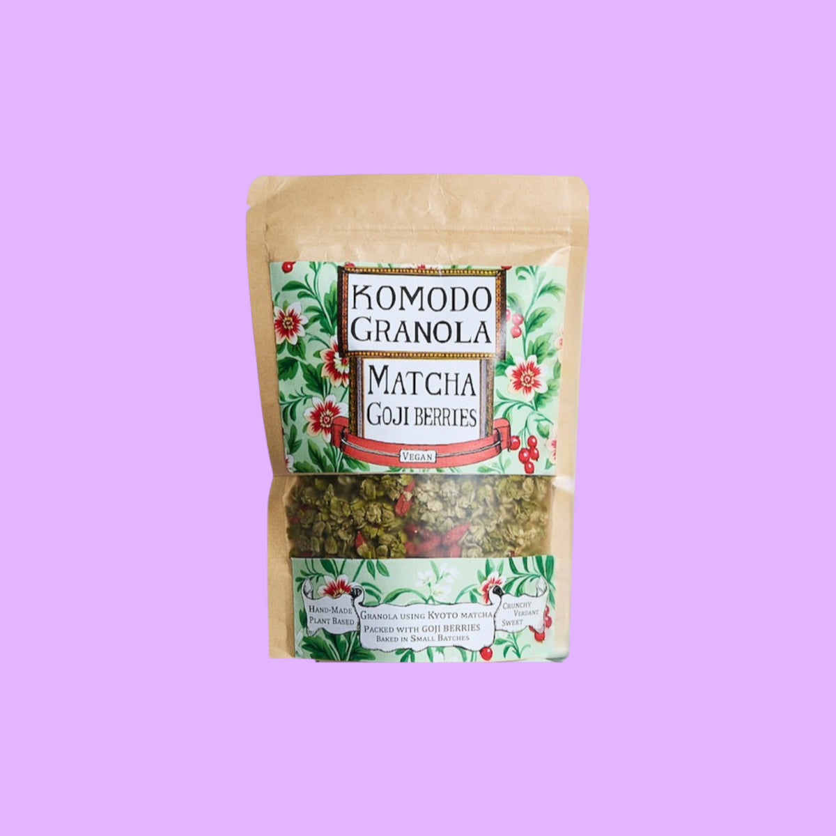 Komodo Bakery vegan matcha and goji berry granola in a resealable kraft pouch with floral label design.