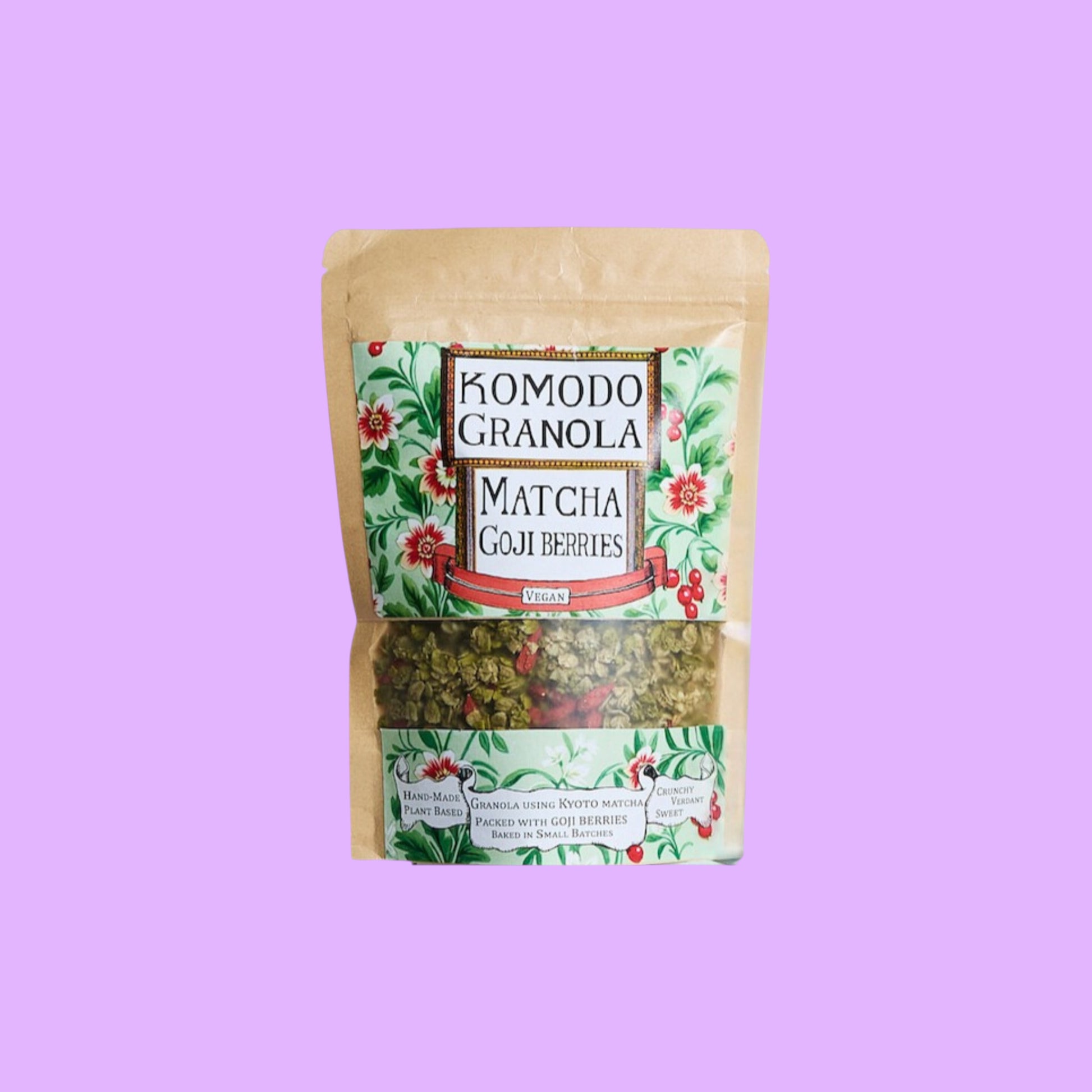 Komodo Bakery vegan matcha and goji berry granola in a resealable kraft pouch with floral label design.