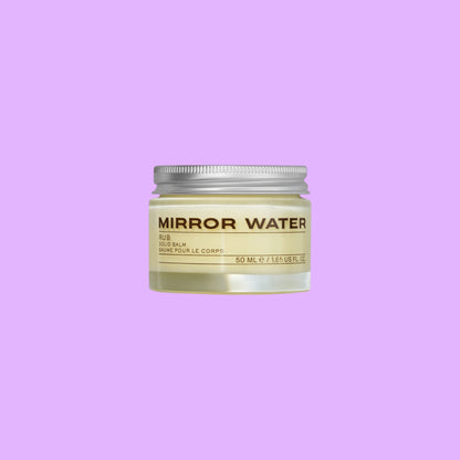 MIRROR WATER RUB solid body balm in a 50ml reusable glass jar with a silver lid against a light background.
