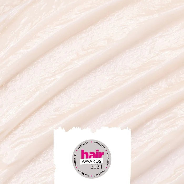 UpCircle natural hair conditioner crème texture with a smooth white creamy consistency and 2024 hair awards badge