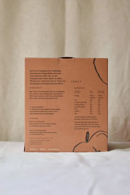 Nibs Etc. granola packaging back view showing ingredients, nutrition facts, and upcycled apple pulp details.