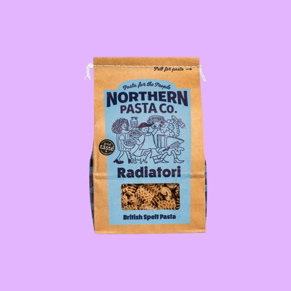 Northern Pasta Co. Radiatori in a brown paper bag with blue branding and a window showing the ruffled pasta.