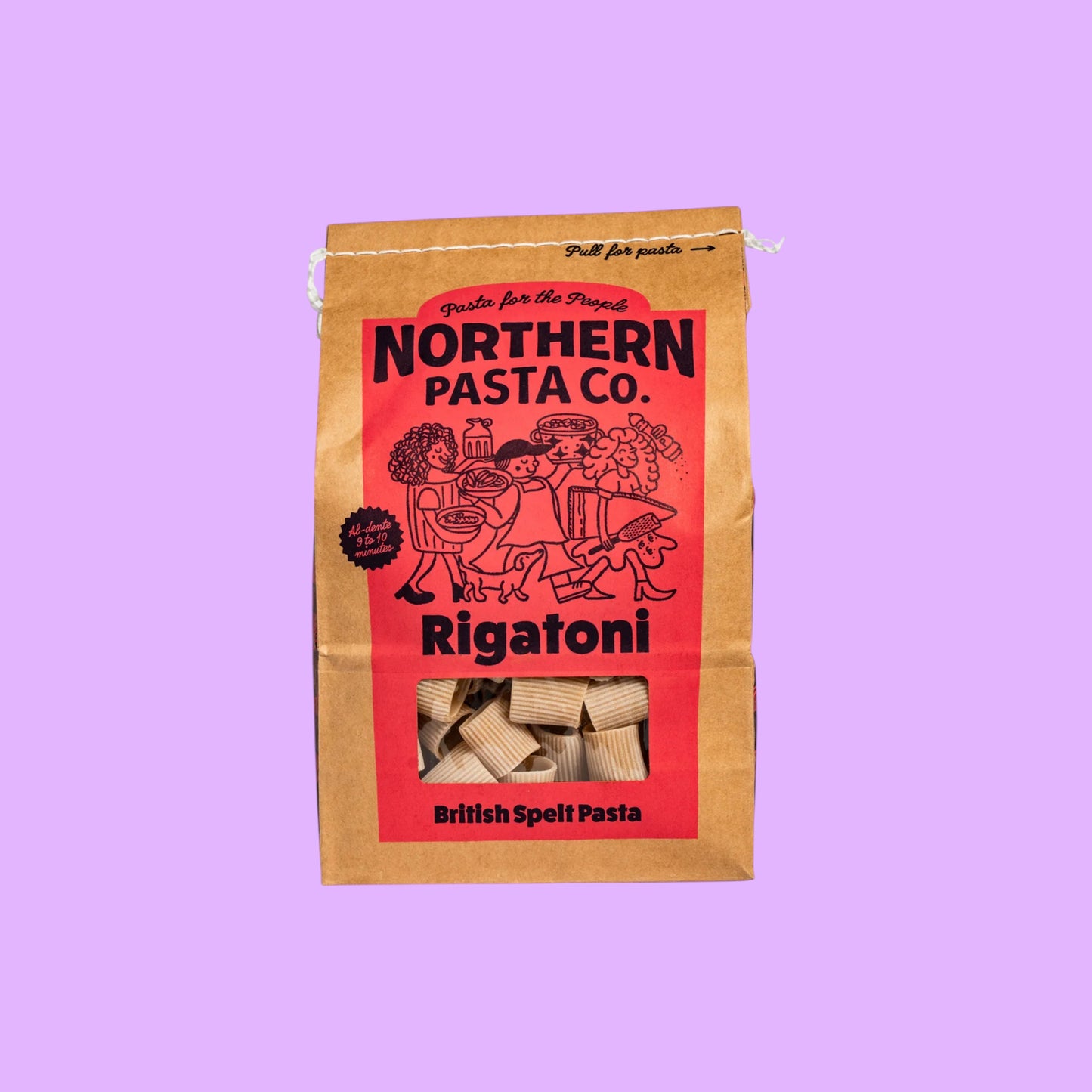 Northern Pasta Co. Rigatoni in a brown paper bag with red branding and a clear window showing the spelt pasta.