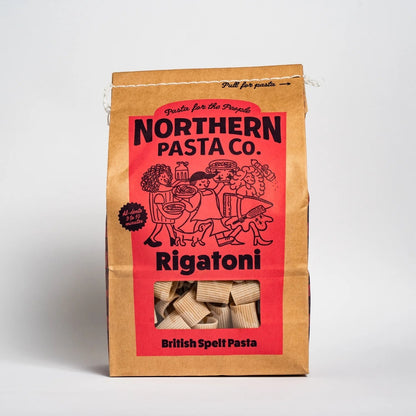Northern Pasta Co. Rigatoni in a brown paper bag with red branding and a window showing the spelt pasta shapes (view 5).