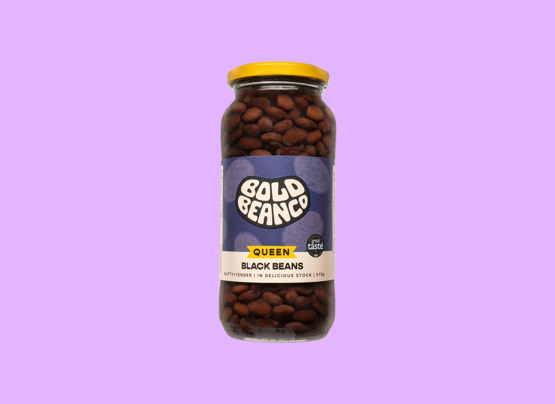 Bold Bean Co Queen Black Beans in a 570g glass jar with a yellow lid and purple label featuring Bold Bean Co branding.