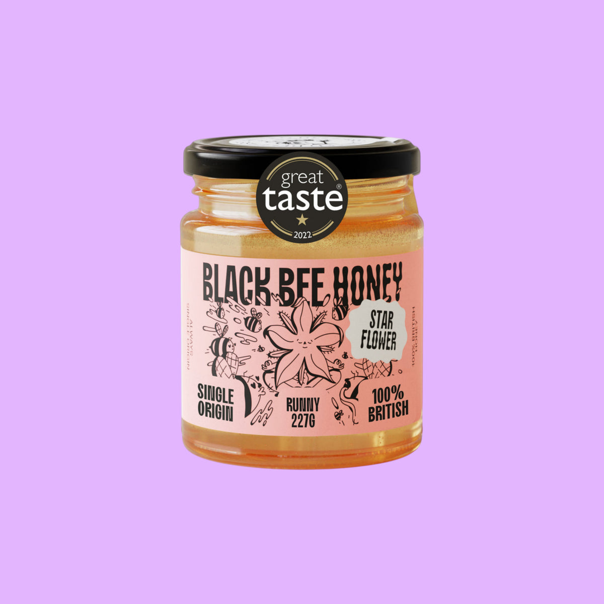 Black Bee Honey raw starflower honey in a glass jar with a Great Taste Award label on a light background.