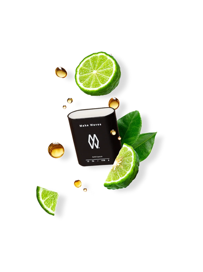 Make Waves refillable antiperspirant capsule in black with fresh bergamot slices and oil droplets