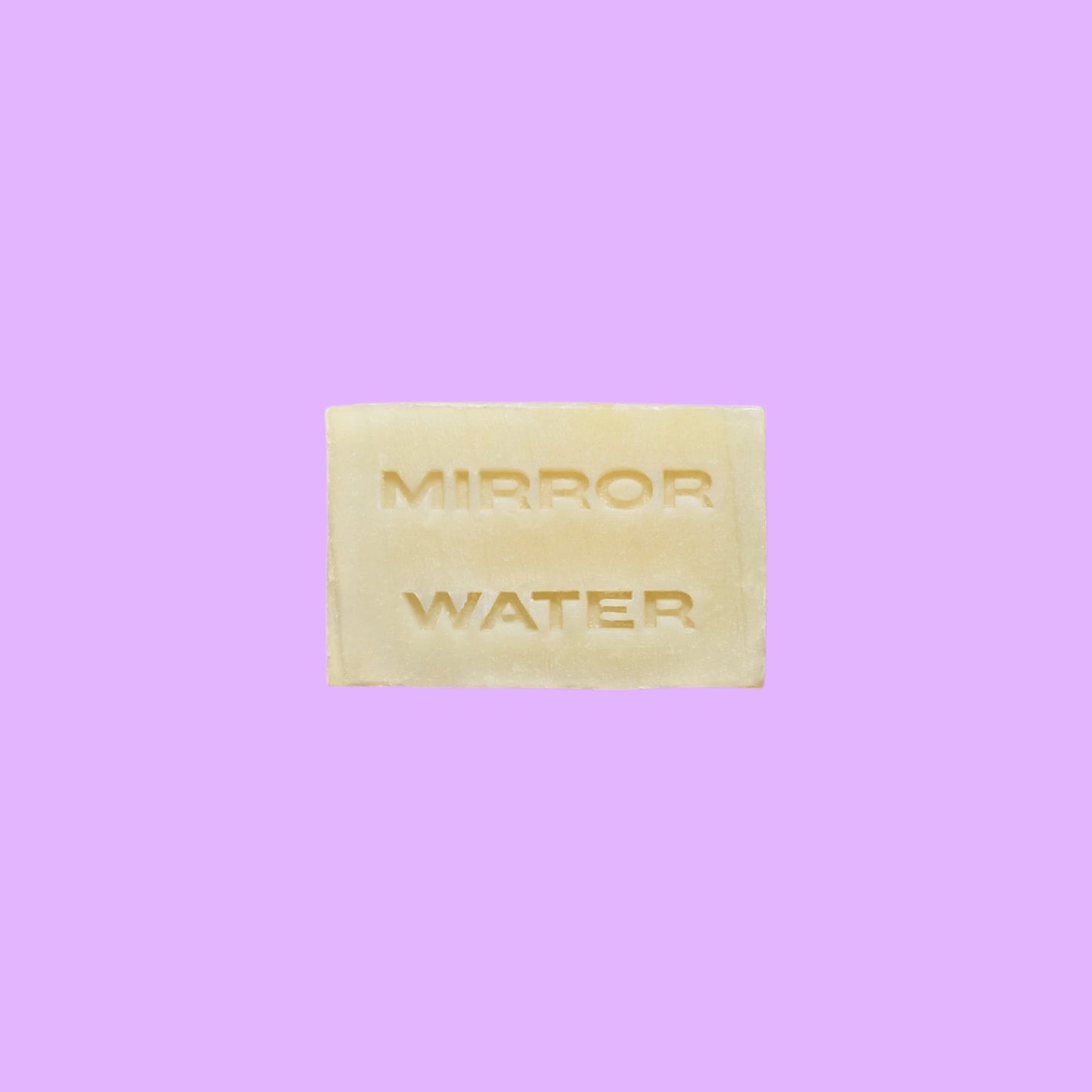 Mirror Water Shea Butter Brick solid face and body cleanser bar with embossed lettering on a neutral background