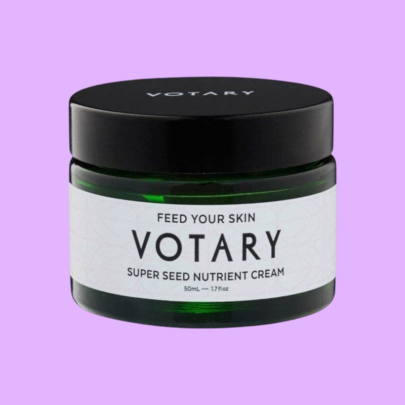 Votary Super Seed Nutrient Cream in a dark green glass jar with a black lid for hydrating and antioxidant skincare (view 2).