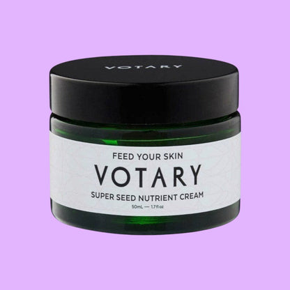 Votary Super Seed Nutrient Cream in a dark green glass jar with a black lid for hydrating and antioxidant skincare (view 2).